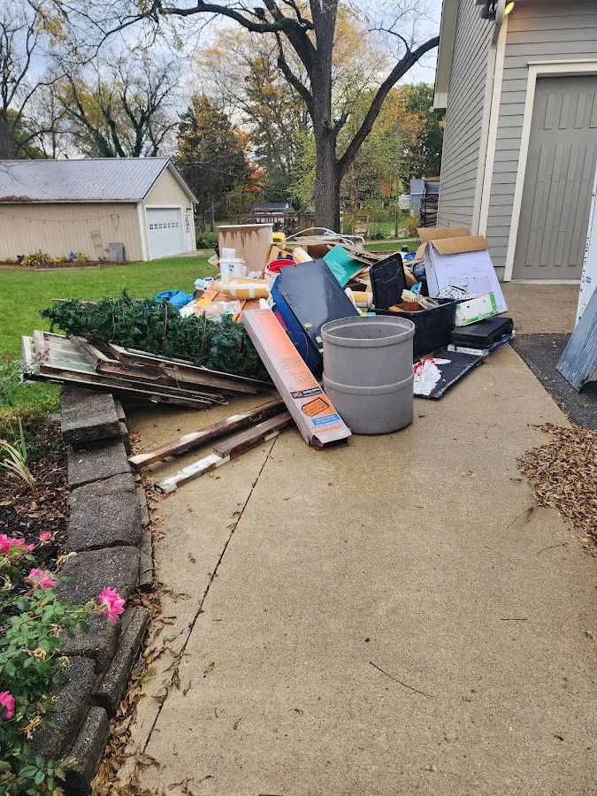 Dumpster being loaded with debris for Demolition Dumpster Rental in Wapakoneta